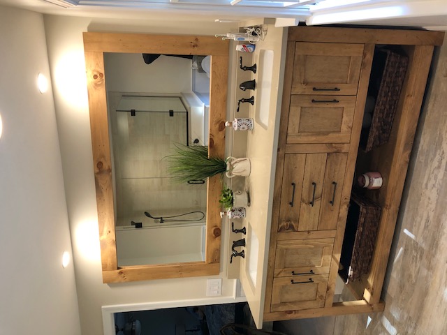 Rustic master bathroom vanity with matte black fixtures
