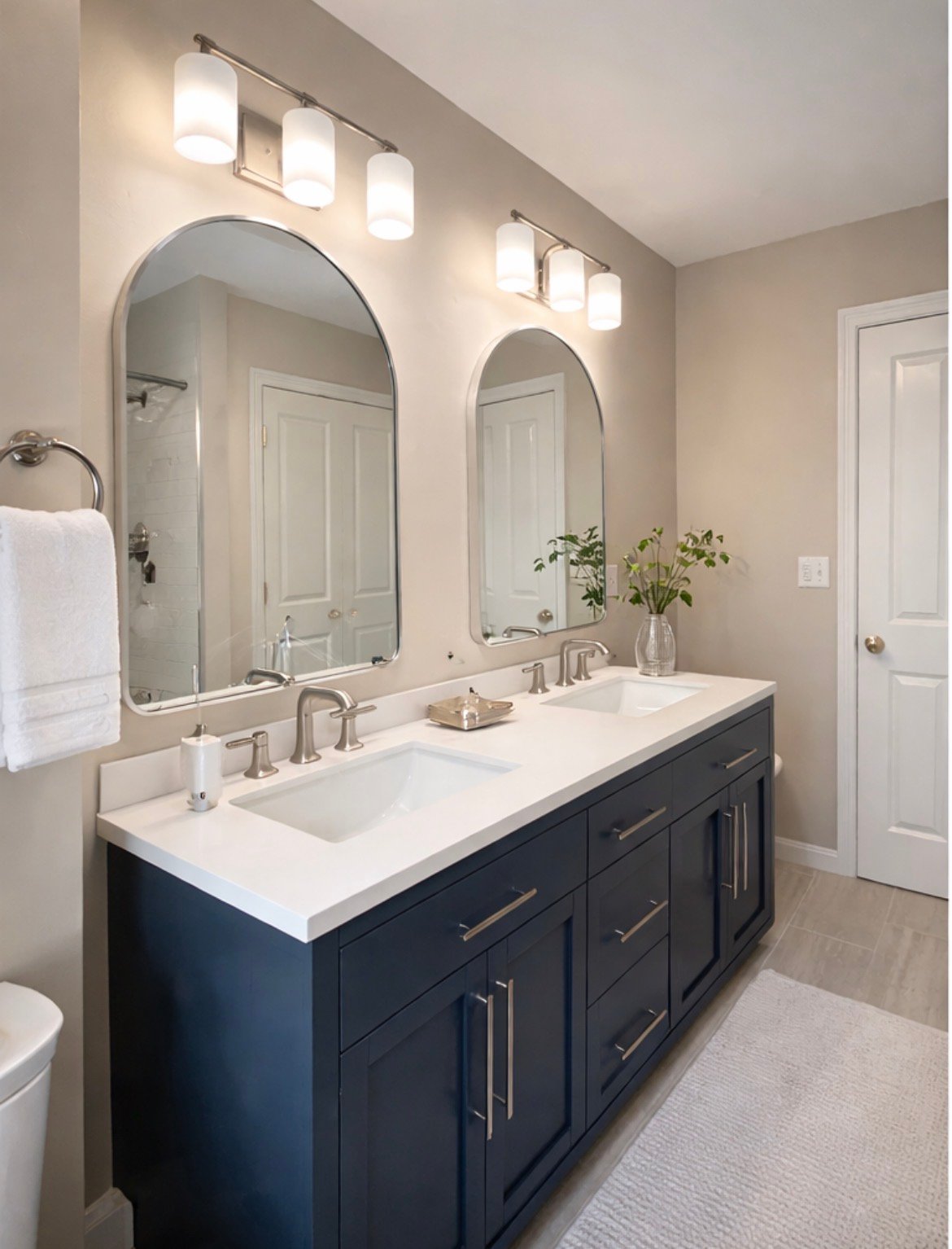 Dark espresso double vanity with marble countertop and framed mirrors